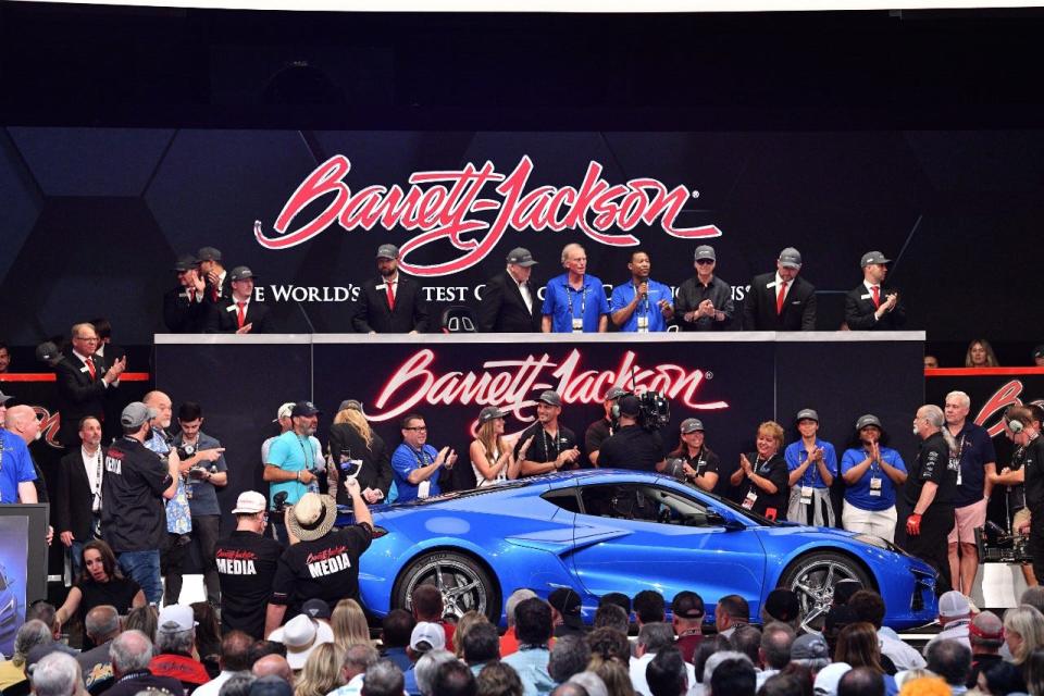 Side profile view of 2024 Chevrolet Corvette E-Ray in Riptide Blue crossing the auction block at the 2023 Barrett-Jackson Palm Beach auction.