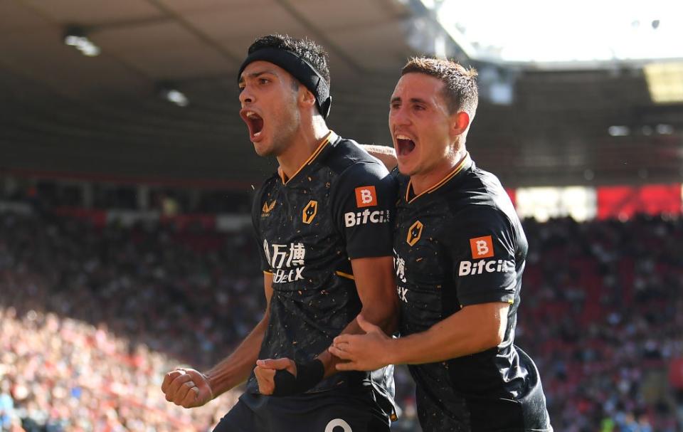 Daniel Podence helps Jimenez celebrate his first goal since injury sidelined the Mexican in November 2020 (Getty)