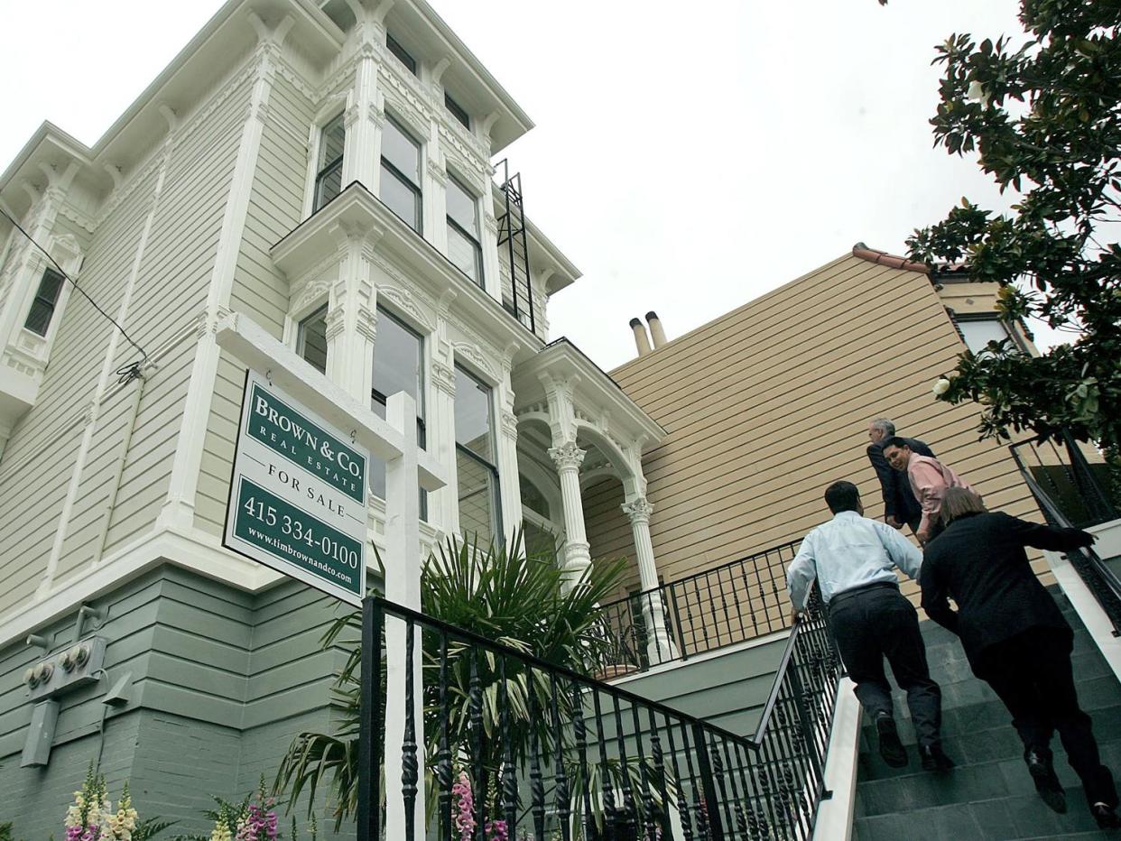 For sale sign in front of home, San Francisco, California. Purchase demand increased following the dip in rates registered the past three weeks, according to the Mortgage Bankers Association. (Credit: Getty Images)