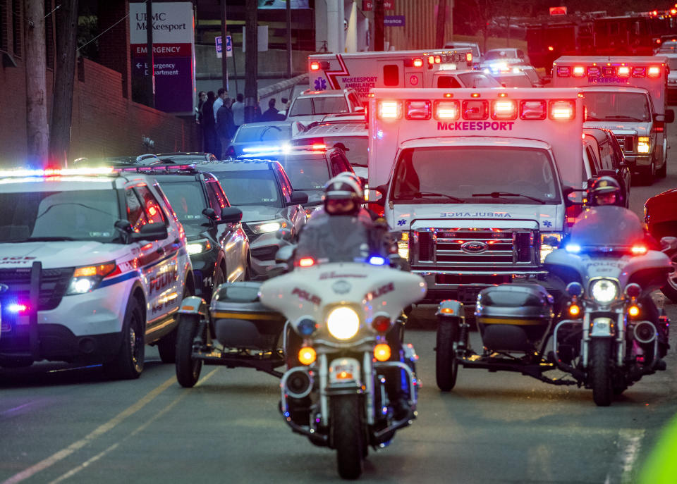 Members of the Pittsburgh police motorcycle unit lead a procession that includes the body of a fallen McKeesport police officer as it leaves UPMC McKeesport on Monday, Feb. 6, 2023, in McKeesport, Pa. One McKeesport police officer was killed, and another was wounded Monday afternoon after responding to a domestic disturbance call where they were fired upon by a man authorities described as having a "mental health crisis. (Arturo Fernandez/Pittsburgh Post-Gazette via AP)