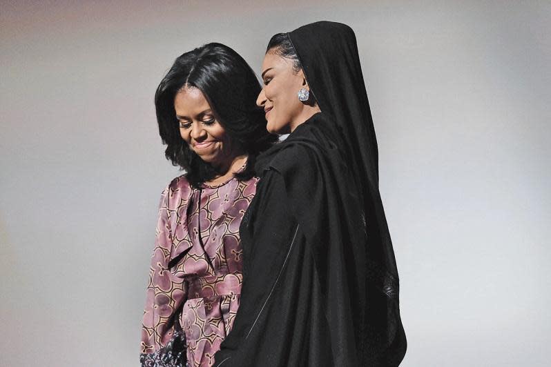 Michelle Obama and Sheikha Moza bint Nasser on stage during the World Innovation Summit for Education in Doha, Qatar. (The Washington Post/Getty Images)