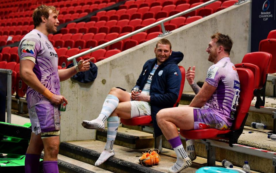 Scotland internationals Jonny Gray (left), Finn Russell (centre) and Stuart Hogg (right) share a beer after the Champions Cup final - GETTY IMAGES