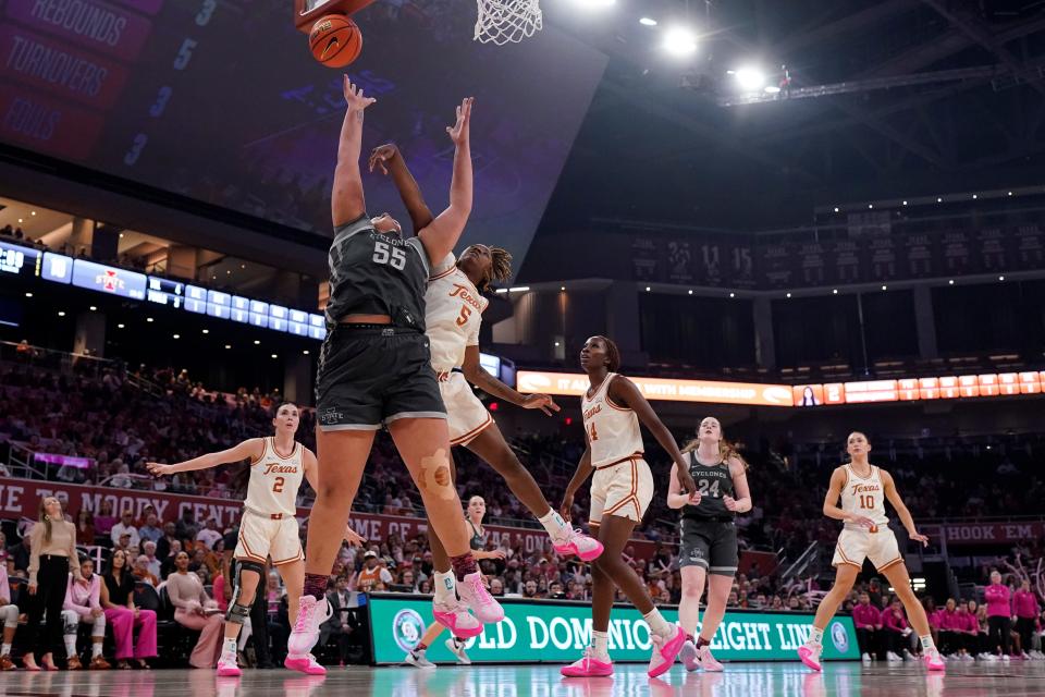 Iowa State center Audi Crooks (55) shoots past Texas forward DeYona Gaston (5) on Saturday. Crooks has surpassed even her own expectations for herself during her freshman campaign.