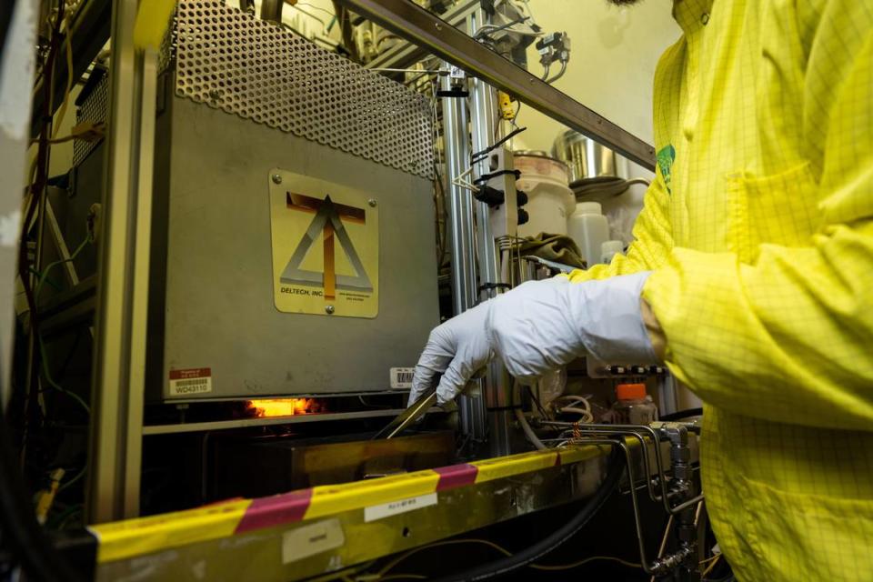 Scientists and engineers at PNNL vitrify Hanford tank waste — turning it from a liquid into a solid glass form — in the Radiochemical Processing Lab.