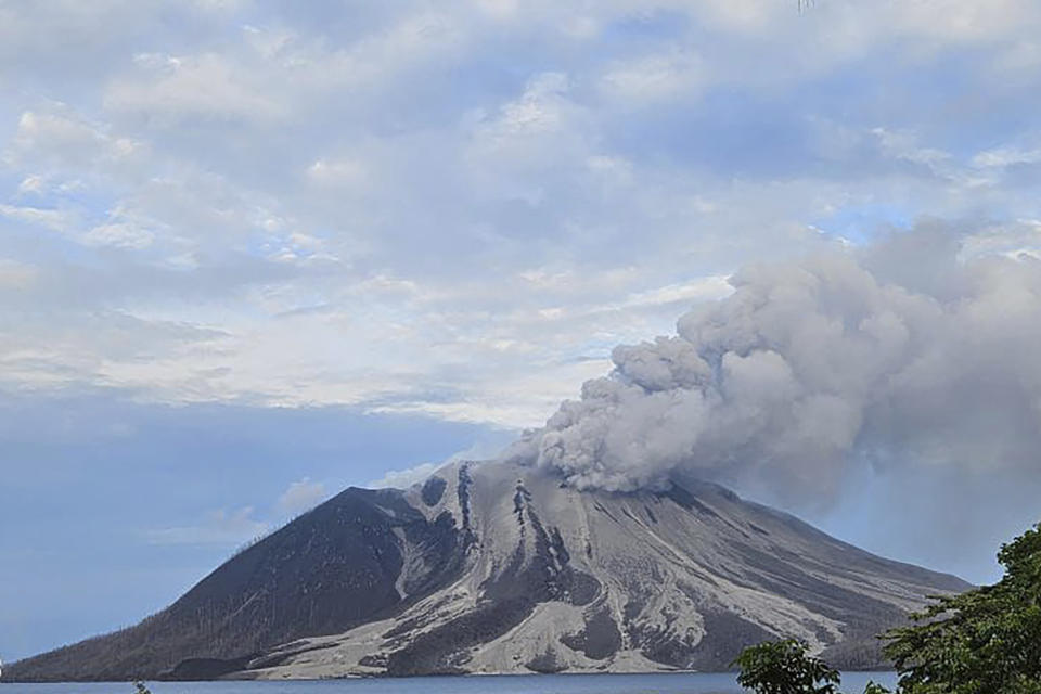 In this photo released by the Vulcanology and Geological Disaster Mitigation Center (PVMBG) of the Indonesian Ministry of Energy and Mineral Resources, Mount Ruang releases volcanic materials during its eruption on Wednesday, May 1, 2024, on Sulawesi Island, Indonesia. Indonesia's Mount Ruang volcano erupted Tuesday for a second time in two weeks, spewing ash almost 2 kilometers (more than a mile) into the sky, closing an airport and peppering nearby villages with debris. (PVMBG via AP Photo)