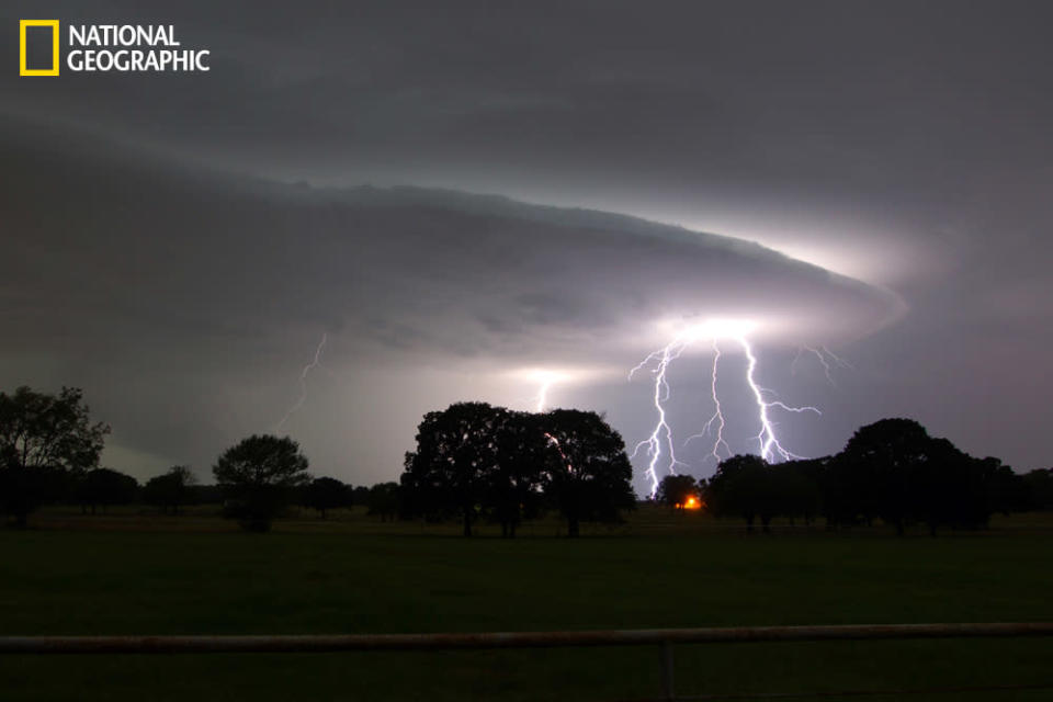 Image of lightning shot looking east toward Dallas. (Photo and caption Courtesy Ricky Niell / National Geographic Your Shot) <br> <br> <a href="http://ngm.nationalgeographic.com/your-shot/weekly-wrapper" rel="nofollow noopener" target="_blank" data-ylk="slk:Click here;elm:context_link;itc:0;sec:content-canvas" class="link ">Click here</a> for more photos from National Geographic Your Shot.