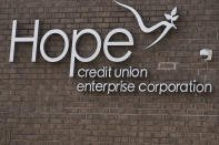 Signage decorates the corporate office of Hope Enterprise Corporation, which runs a Mississippi-based credit union, in Jackson, Miss., Monday, Feb. 8, 2021. Hope is partnering with seven cities and nine historically Black colleges and universities to launch the “Deep South Economic Mobility Collaborative." Goldman Sachs 10,000 Small Businesses initiative is providing up to $130 million to the endeavor, which will be available to clients in Louisiana, Mississippi, Alabama, Arkansas and Tennessee. (AP Photo/Rogelio V. Solis)