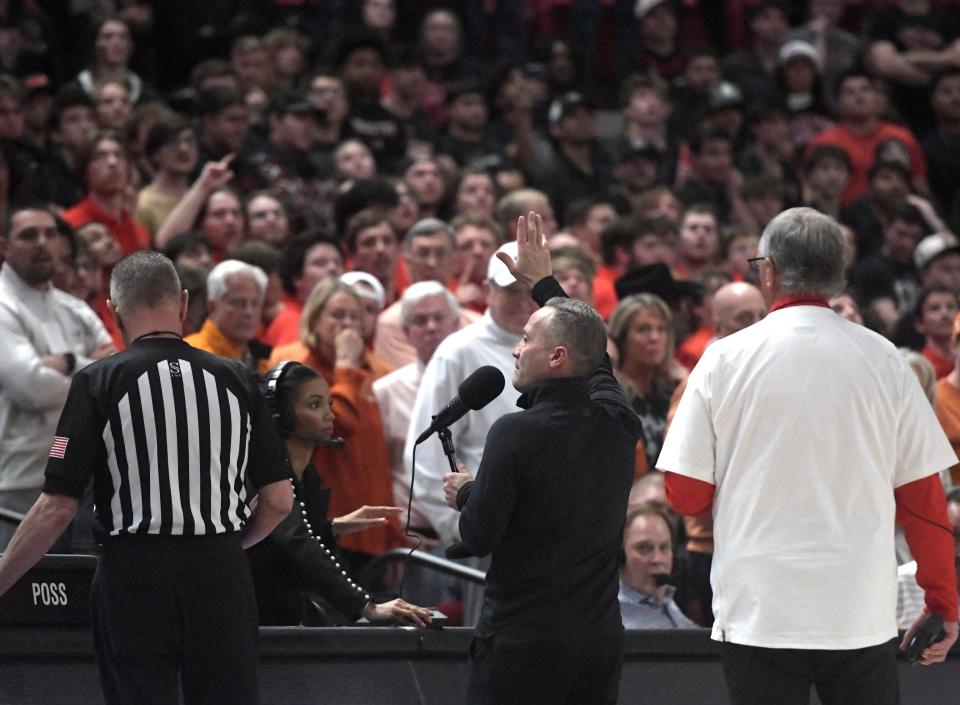 Texas Tech's head coach Grant McCasland speaks to fans after objects are thrown on to the court during the Big 12 basketball game against Texas, Tuesday, Feb. 27, 2024, at United Supermarkets Arena.