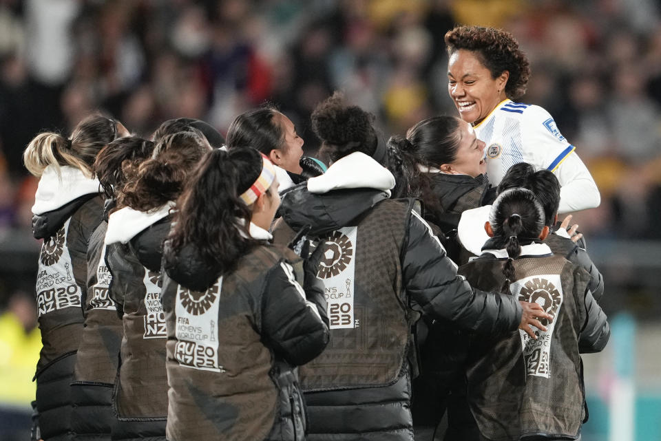 Philippines' Sarina Bolden, right, celebrates with her teammates on the bench after scoring her team's first goal during the Women's World Cup Group A soccer match between New Zealand and the Philippines in Wellington, New Zealand, Tuesday, July 25, 2023. (AP Photo/John Cowpland)