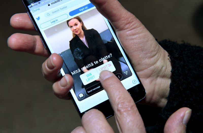 An Instagram post depicting Finnish Finance Minister Katri Kulmuni is seen on a phone running the Twitter app in Helsinki