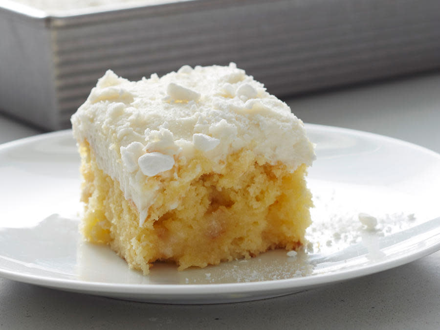 Vanilla Buttermilk Poke Cake with Buttercream Frosting