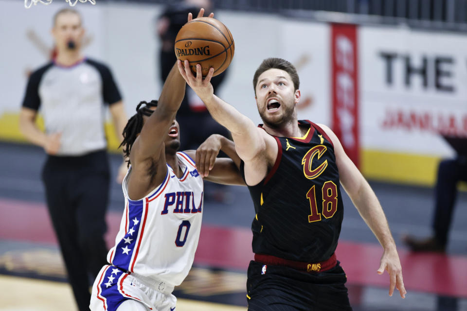 Cleveland Cavaliers' Matt Dellavedova (18) goes up to shoot against Philadelphia 76ers' Tyrese Maxey (0) in the first half of an NBA basketball game, Thursday, April 1, 2021, in Cleveland. (AP Photo/Ron Schwane)