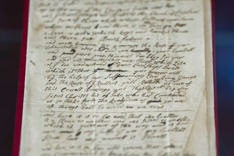 FILE - The handwritten letter from 1723 – whose author says they are remaining anonymous for fear they will "swing upon the gallows tree" if exposed, is displayed at the exhibition in the Lambeth Palace Library, in London, on Jan. 31, 2023. An advisory panel says the Church of England should create a fund of 1 billion pounds ($1.27 billion) to address its historic links to slavery. That's 10 times the amount the church has already set aside. (AP Photo/Kin Cheung, File)