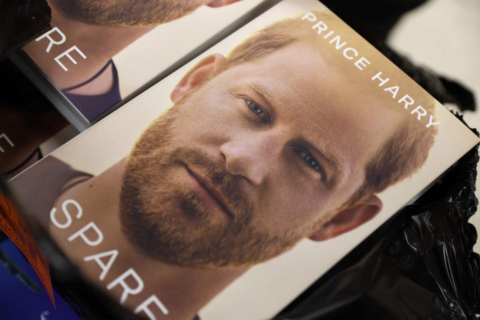 The book "Spare", by Britain's Prince Harry, Duke of Sussex, is unpacked during a special midnight opening event for the release of  the memoire at the WHSmith bookstore, at Victoria Station in London, on January 9, 2023. - The midnight release of "Spare" is being accompanied by four television interviews in Britain and the United States, where Harry now lives with his wife Meghan. The most explosive passages of his book have already gone viral since bookstores in Spain mistakenly placed it on their shelves for a few hours on January 5, 2023. (Photo by ISABEL INFANTES / AFP) (Photo by ISABEL INFANTES/AFP via Getty Images) ORIG FILE ID: AFP_336R6NC.jpg