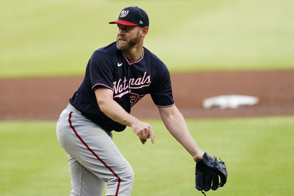 Washington Nationals starting pitcher Stephen Strasburg reacts after giving up a double in the first inning of a baseball game Tuesday, June 1, 2021, in Atlanta. (AP Photo/John Bazemore)