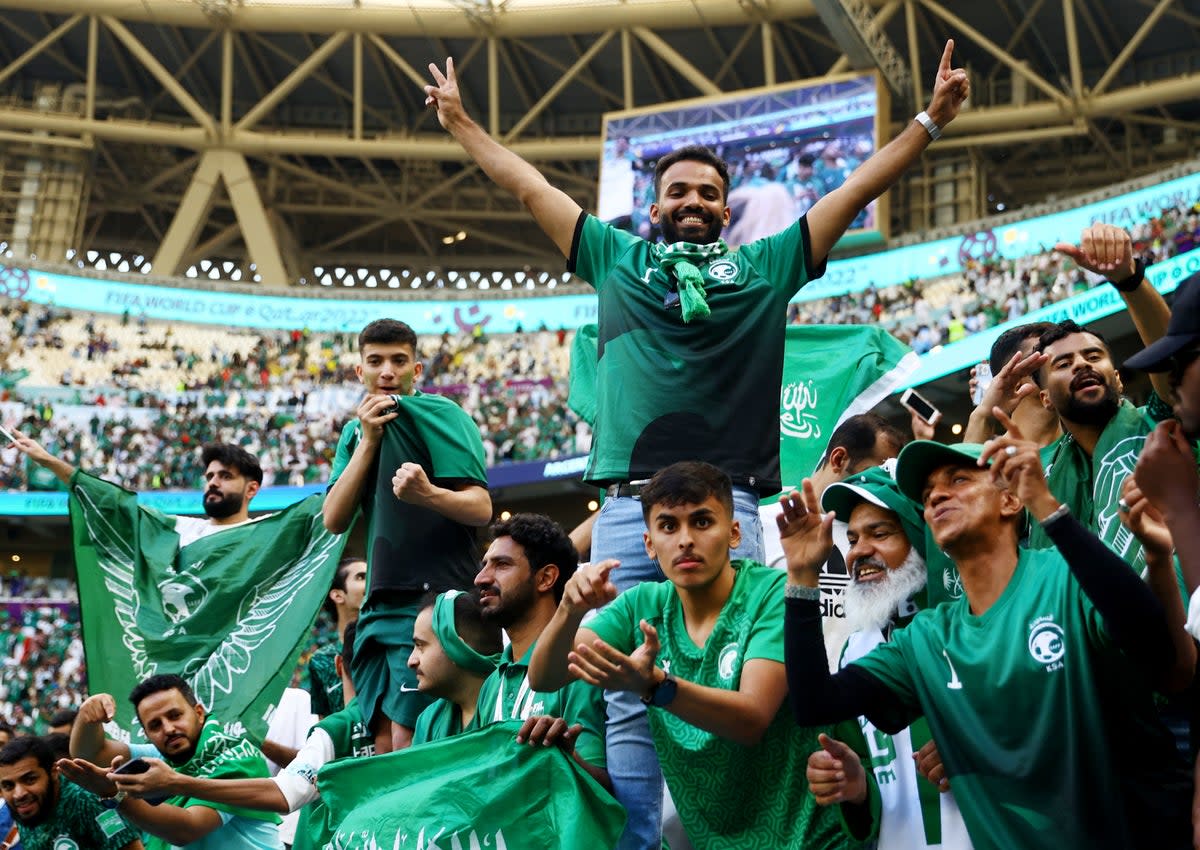 Saudi Arabian fans celebrate after the match (Reuters)