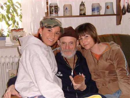 Taekwondo athlete Mandy Meloon (L) poses with her grandfather Heinz Dieter Mrugalla and mother Martina Flores shortly after winning the bronze medal in the 2005 World Championships, in Zweibrueken, Germany and provided April 10, 2018. Courtesy of Mandy Meloon/Handout via REUTERS