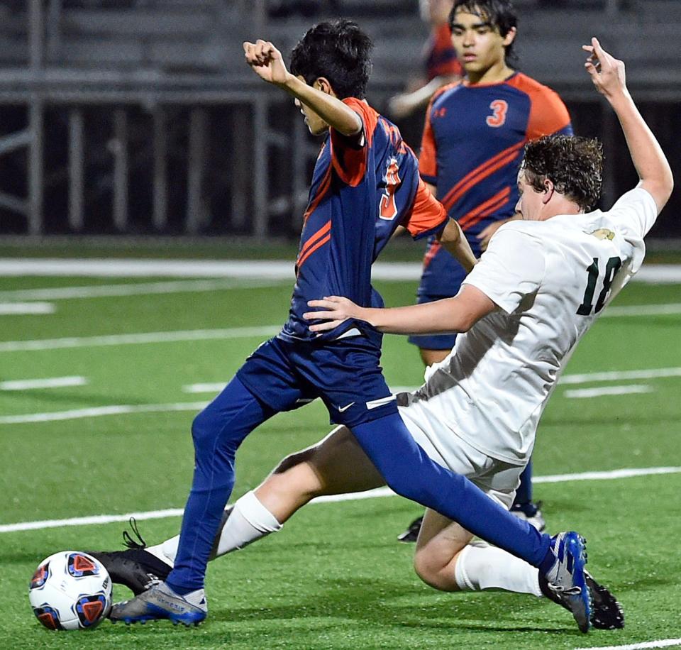 Saint Stephen's Jack Holmes, on right, and Bradenton Christian's Rolando Velasquez battle for the ball during Tuesday night's game at Bradenton Christian's Dan van der Koy Field.