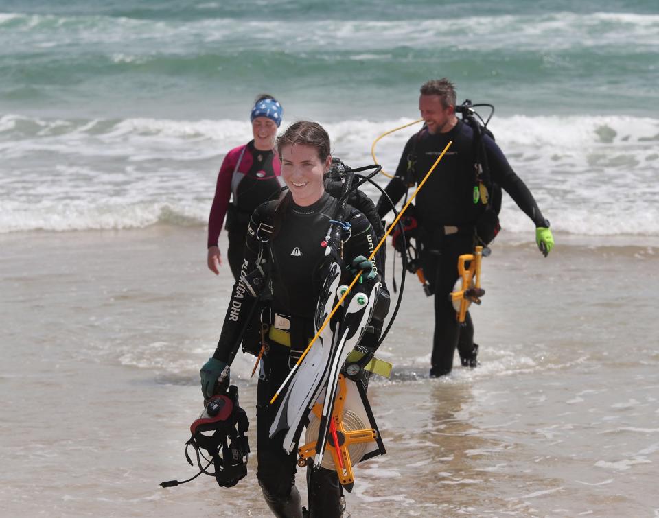 Melissa Price, a Florida Department of State archaeologist smiles after checking out the shipwreck site following a dive, Thursday, April 27, 2023, in Daytona Beach Shores.