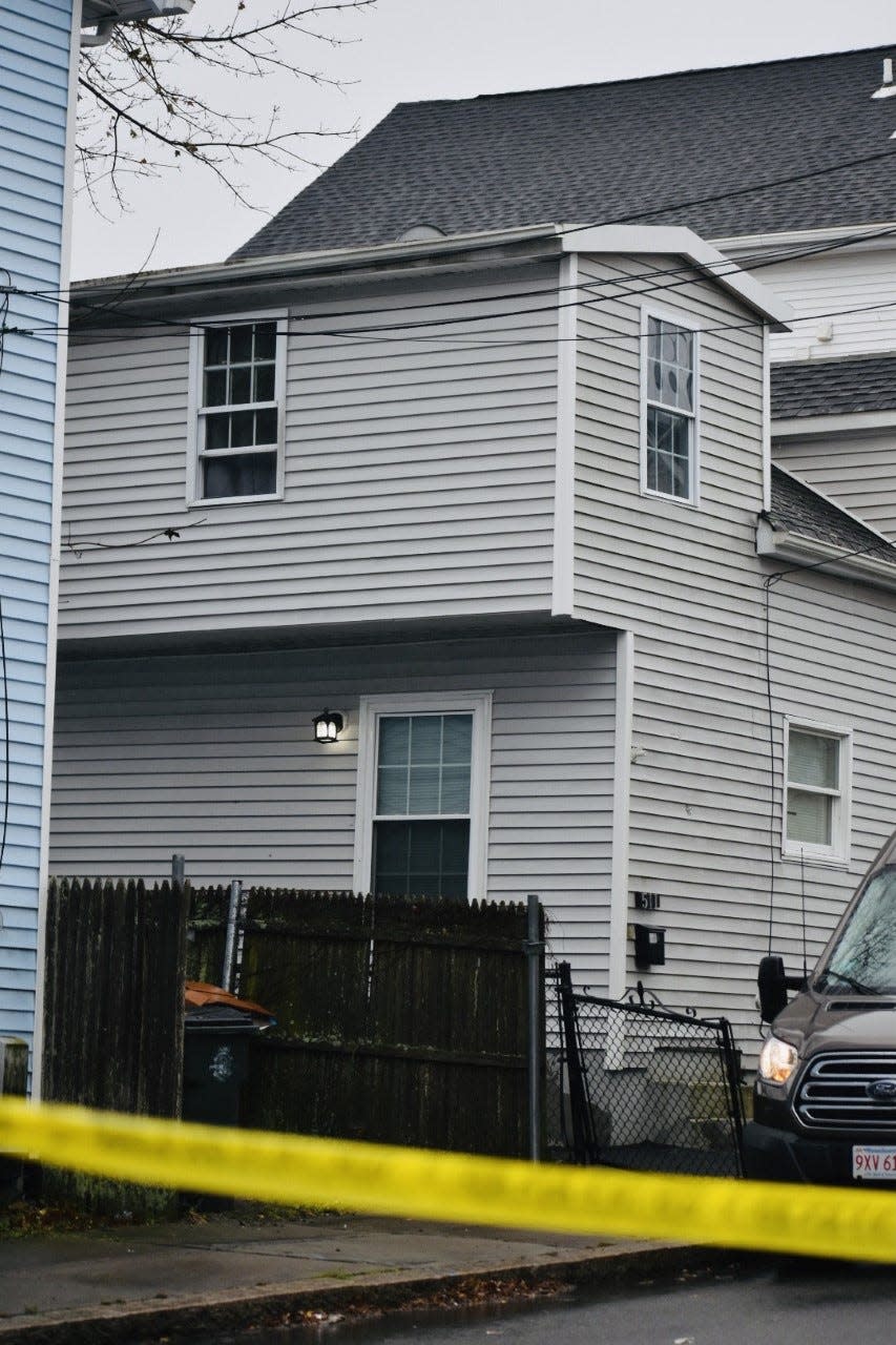 Police tape surrounds the Bank Street area where two men were killed in a shooting early Wednesday, Dec. 7, in Fall River.
