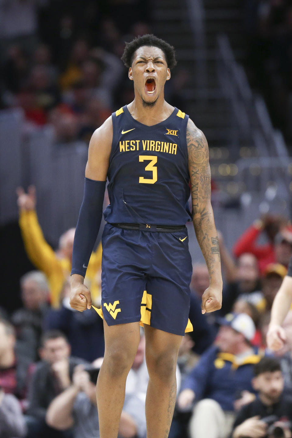 West Virginia's Gabe Osabuohien celebrates during the second half of an NCAA college basketball game against Ohio State Sunday, Dec. 29, 2019, in Cleveland. West Virginia defeated Ohio State 67-59. (AP Photo/Ron Schwane)