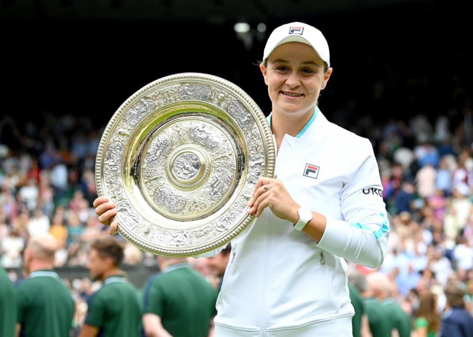 PHOTO: Ashleigh Barty of Australia is presented with the Venus Rosewater Dish trophy after winning her Ladies' Singles Final match at Wimbledon Championships Tennis Tournament at All England Lawn Tennis and Croquet Club on July 10, 2021 in London. (Karwai Tang/WireImage via Getty Images, FILE)