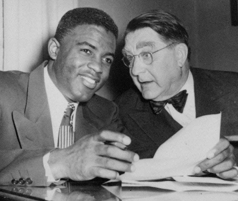 Branch Rickey, right, an Ohio Wesleyan alumnus, was the Brooklyn Dodgers president and general manager who signed Jackie Robinson, left, to break the color barrier in Major League Baseball.