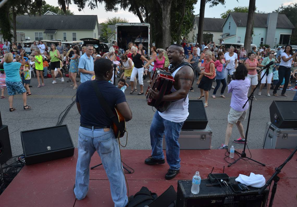 Dwayne “Dopsie” Rubin, center, gets Port Royal up and dancing with Guitarist Kipori Woods and the rest of Dwayne Dopsie and the Zydeco Hellraisers during a previous Street Music concert on Paris Avenue.