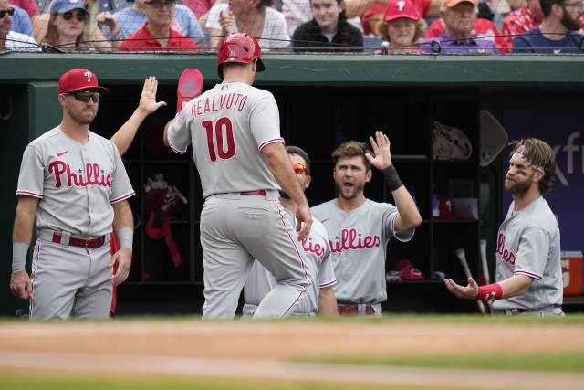 J.T. Realmuto of Team USA reacts to hitting a double in the second