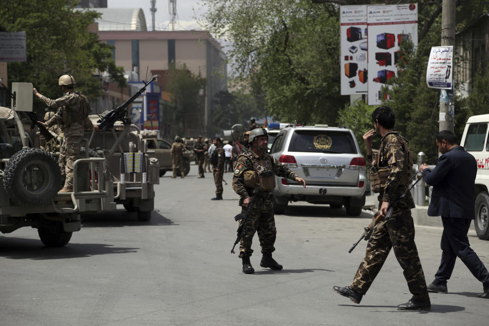 Afghan security personnel arrives near the site of a huge explosion in Kabul, Afghanistan, Wednesday, May 8, 2019. Insurgents targeted the counterpart international organization located near the offices of the attorney general in the capital Kabul, said Afghan officials on Wednesday. (AP Photo/Rahmat Gul)