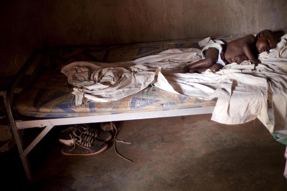 In this Monday, March 25, 2014 photo, 8-month-old Sherlie Jean-Baptiste sleeps on a bed at the Hospital Evangelique where she is being treated for malnutrition in Bombardopolis, Haiti. Even before the drought began in this region in October, a government report found chronic malnutrition affecting a quarter of the region’s people. Since then, malnutrition among children has spiked, said Faith Leach, an administrator at the Evangelical Hospital in Bombardopolis. (AP Photo/Dieu Nalio Chery)