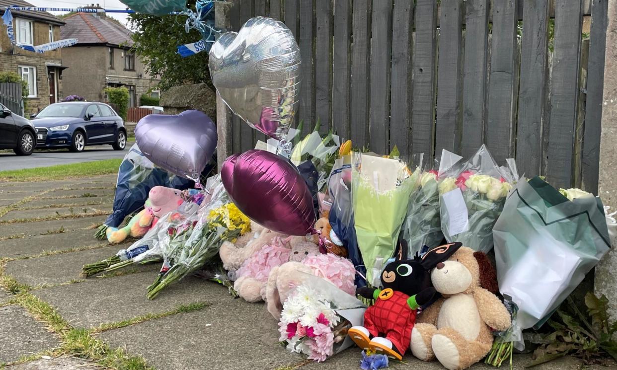 <span>Flowers and tributes near the scene of a fatal house fire in Bradford.</span><span>Photograph: Dave Higgins/PA</span>