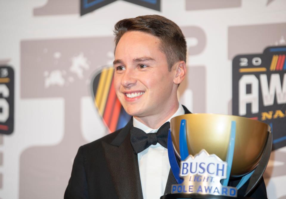 Christopher Bell poses with his Busch Light Pole Award on the red carpet for the 2023 NASCAR Awards Banquet at the Music City Center in Nashville, Tenn., Thursday, Nov. 30, 2023.