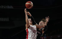 Canada's Natalie Achonwa (11), left, and South Korea's Ji Su Park (19) scramble for a rebound during women's basketball preliminary round game at the 2020 Summer Olympics, Thursday, July 29, 2021, in Saitama, Japan. (AP Photo/Eric Gay)