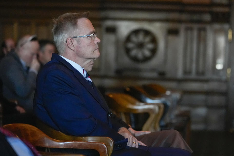 Plaintiff John Rust listens during oral arguments before the Indiana Supreme Court at the Statehouse in Indianapolis, Monday, Feb. 12, 2024. GOP Senate candidate, John Rust, who is suing to appear on the primary ballot. A trial judge ruled in December that a state law that stipulates candidates must vote in two primary elections with their party is unconstitutional. The state appealed the ruling. (AP Photo/Michael Conroy, Pool)