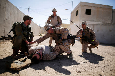 U.S. Marines and Israeli soldiers practice urban combat during Juniper Cobra, a U.S.-Israeli joint air defence exercise, in Zeelim, southern Israel, March 12, 2018. Picture taken March 12, 2018. REUTERS/Amir Cohen