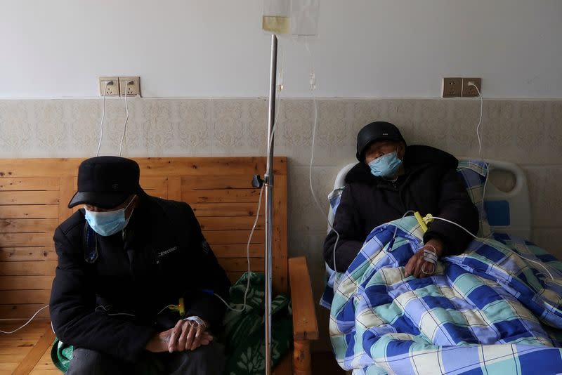 Patients at a clinic in Lezhi county