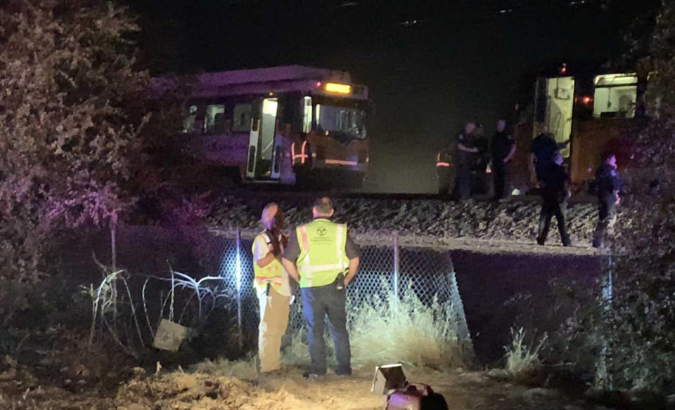 CORRECTS TO TAKE OUT REFERENCE OF DERAILMENT - In this image made from video, a Sacramento Regional Transit light-rail car is seen stopped in Sacramento, Calif., on Thursday, Aug. 22, 2019. Authorities are investigating a crash that injured several people when Sacramento light rail commuter train struck a maintenance train. Sacramento Regional Transit spokeswoman Devra Selenis says Friday that the maintenance train was not moving when the crash happened late Thursday. (Daniel Hunt/The Sacramento Bee via AP)