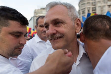 Romania's ruling Social Democratic Party leader Liviu Dragnea is greeted by supporters during a demonstration in Bucharest, Romania, June 9, 2018. Inquam Photos/Liviu Florin Albei via REUTERS