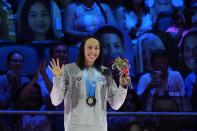 Torri Huske reacts at the nedal ceremony after winning the Women's 100 Butterfly during wave 2 of the U.S. Olympic Swim Trials on Monday, June 14, 2021, in Omaha, Neb. (AP Photo/Charlie Neibergall)