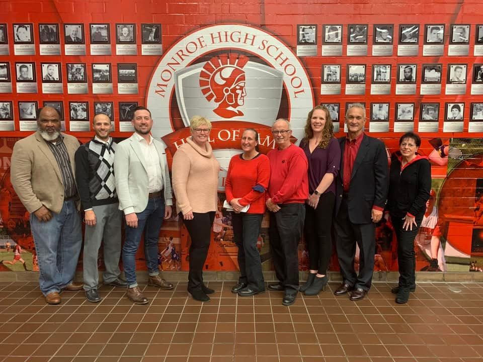 The 2021 inductees to the Monroe High School Athletic Hall of Fame gather for a photo Friday night.