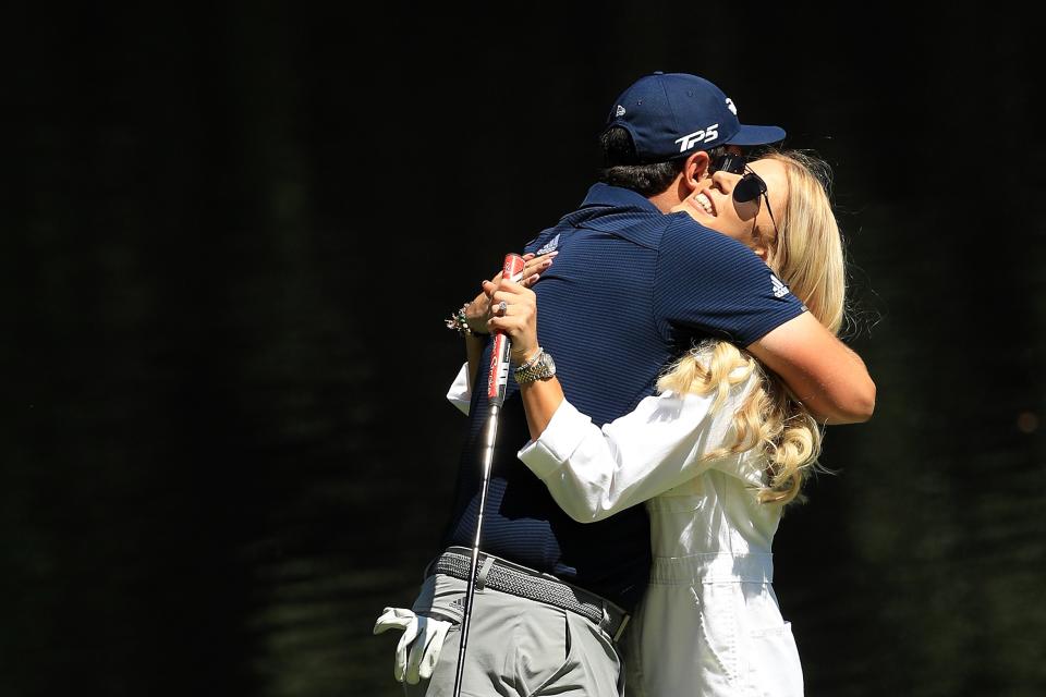 AUGUSTA, GEORGIA - APRIL 10: Jon Rahm of Spain celebrates with fiancee Kelley Cahill after a putt during the Par 3 Contest prior to the Masters at Augusta National Golf Club on April 10, 2019 in Augusta, Georgia. (Photo by Mike Ehrmann/Getty Images)
