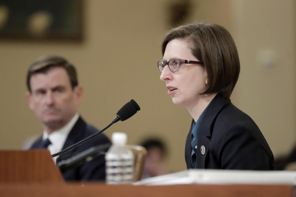 Deputy Assistant Secretary of Defense Laura Cooper testifies before the House Intelligence Committee on Capitol Hill in Washington, Wednesday, Nov. 20, 2019, during a public impeachment hearing of President Donald Trump's efforts to tie U.S. aid for Ukraine to investigations of his political opponents. State Department official David Hale, left, looks on. (Julio Cortez/AP)