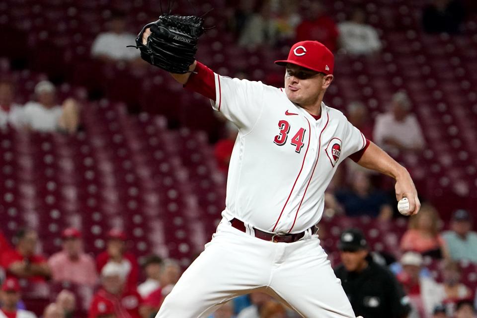 Cincinnati Reds relief pitcher Justin Wilson (34) delivers in the ninth inning of a baseball game against the St. Louis Cardinals, Monday, Aug. 30, 2021, at Great American Ball Park in Cincinnati. The St. Louis Cardinals won, 3-1.