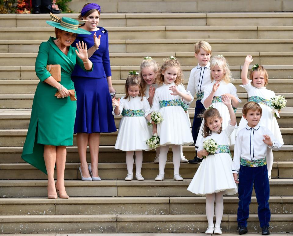 The young royals wave on the steps of Windsor Castle. (Photo: Toby Melville/AFP/Getty Images)