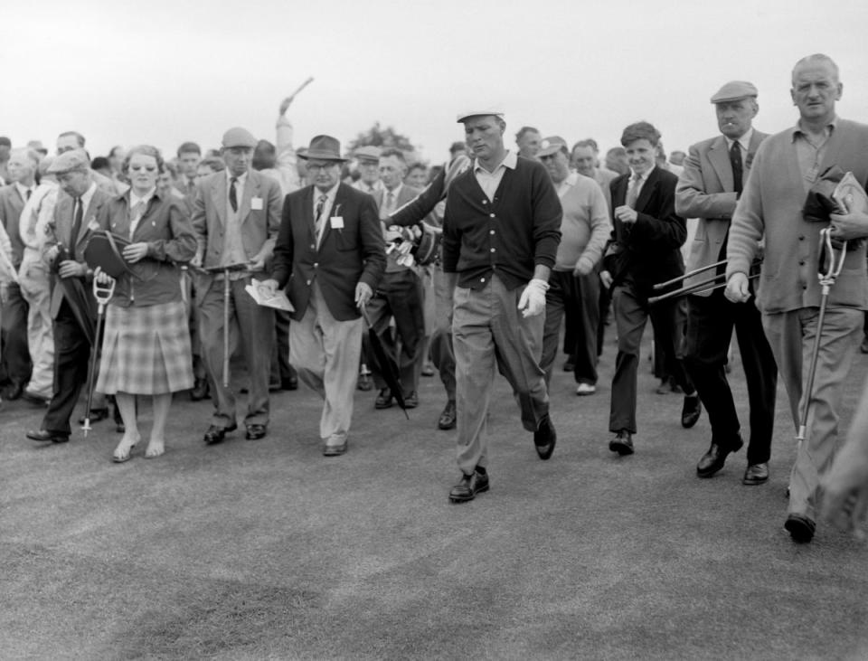 Arnold Palmer followed by spectators during qualifying for the 1960 Open Championship (PA Archive) (PA Archive)