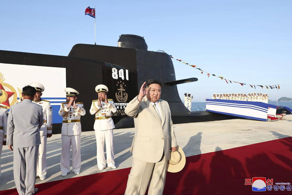 In this photo provided by the North Korean government, North Korea leader Kim Jong Un, foreground, attends a launching ceremony of what is says a new nuclear attack submarine "Hero Kim Kun Ok" at an unspecified place in North Korea Wednesday, Sept. 6, 2023. Independent journalists were not given access to cover the event depicted in this image distributed by the North Korean government. The content of this image is as provided and cannot be independently verified. Korean language watermark on image as provided by source reads: "KCNA" which is the abbreviation for Korean Central News Agency. (Korean Central News Agency/Korea News Service via AP)