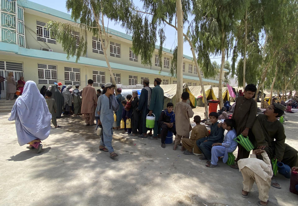 Internally displaced Afghans who fled their home due to fighting between the Taliban and Afghan security personnel, are seen at a camp in Daman district of Kandahar province south of Kabul, Afghanistan, Thursday, Aug. 5, 2021. (AP Photo/Sidiqullah Khan)