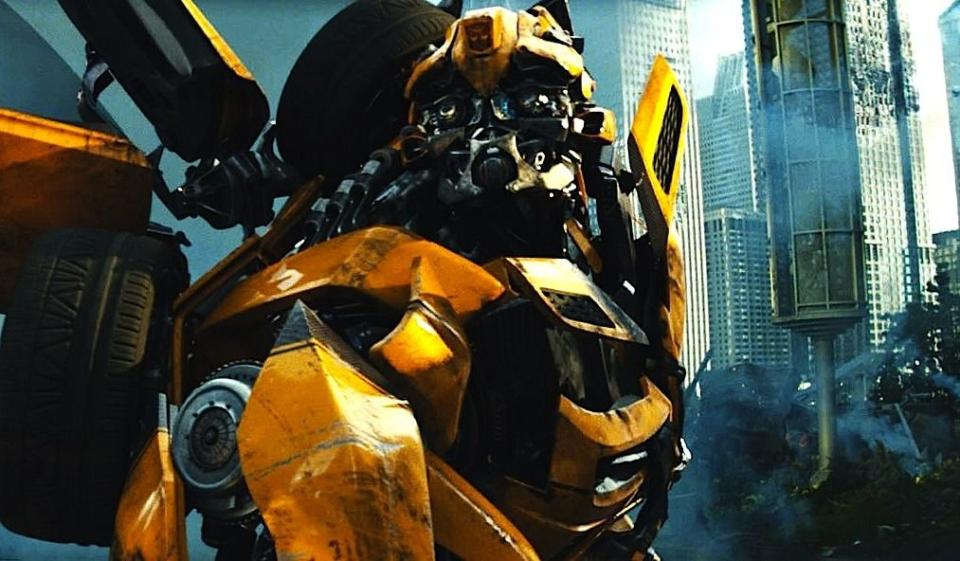 bumblebee in his robot form looks at a city skyline in a scene from transformers dark of the moon