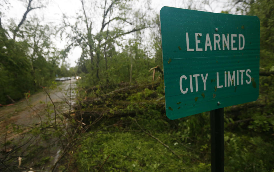 Fallen trees line the roads leading into the small community of Learned, Miss., Thursday, April 18, 2019. Several homes were damaged by fallen trees in the tree lined community. Strong storms again roared across the South on Thursday, topping trees and leaving more than 100,000 people without power across Mississippi, Louisiana and Texas. (AP Photo/Rogelio V. Solis)